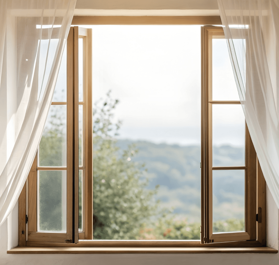 An open window with white curtains looking out over a landscape — a metaphor for opening to new perspectives